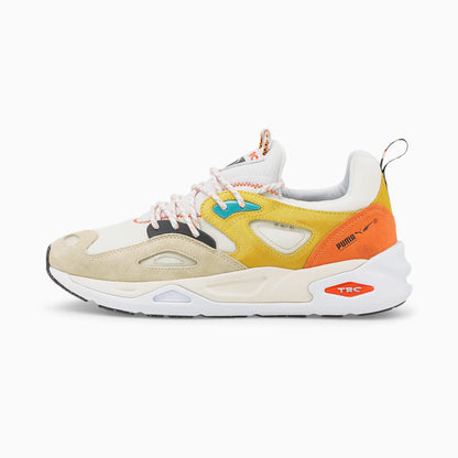 Multicolored sneaker with orange, yellow, and beige accents on a white background